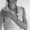 handmade ethical jewellery. organic styled thick bangle in silver and gold plated silver.