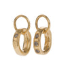 Classic, Twisted Hoop Earrings in Gold. The Classic Twist circles can be purchased plain or with diamonds. All diamonds are set in pave style framed in a squared line: three diamonds sit together on one side and one diamond on the opposite side. All diamonds are natural in colour and available in black, grey or brown, depending on the metal. The earrings come in White Gold, Yellow Gold, 18K and 9K Gold.