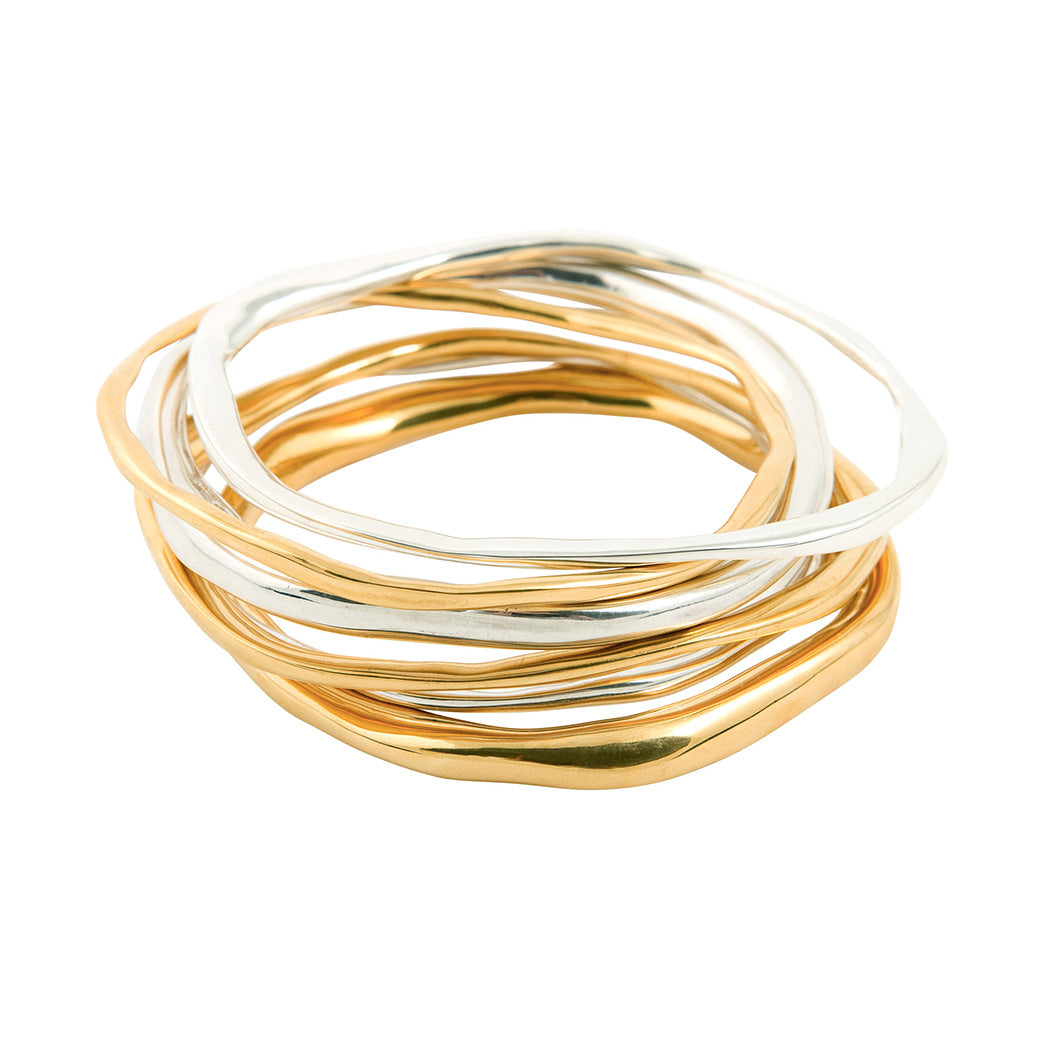 unusual modern organic shaped solid silver bangle in starling silver and gold plated silver made in london