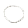 handmade contemporary organic shaped bangle in starling silver.made in london.  Edit alt text