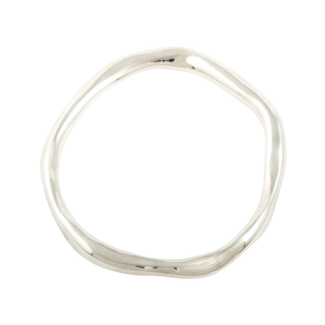 unusual organic shaped thick bangle in starling silver for sustainable fashion made in london  Edit alt text